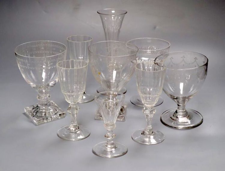 A group of four mid 19th century glass rummers, various cut glass champagne flutes etc.
